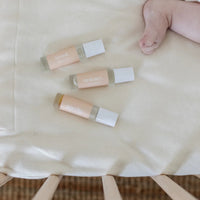 Roll-on essential oils for babies labelled tummy, teethy and tired by Cle Naturals.