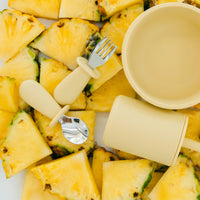 Pineapple chunks with Rommer kids cutlery and a silicone yellow bowl and cup 