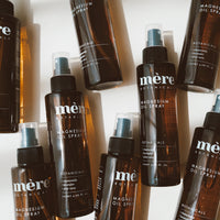 A collection of Mere Botanicals magnesium spray bottles on a white background
